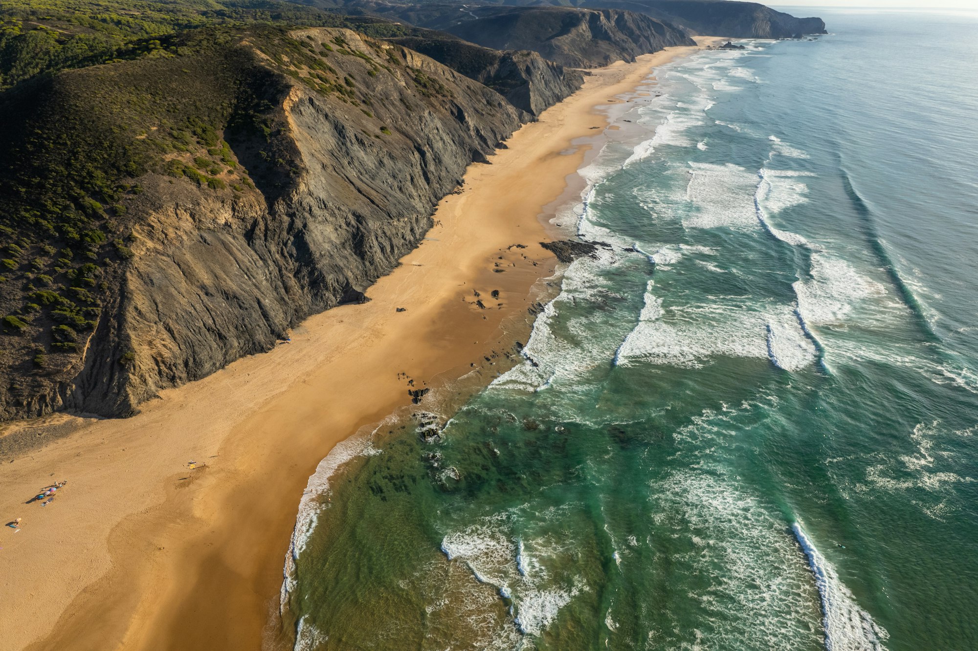 Breathtaking Drone Shot of Cordoama Beach's Pristine Shores in Algarve