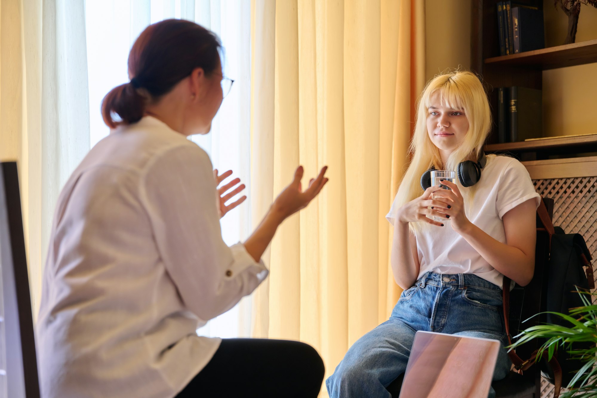 Teenage female in therapy session in psychologist's office